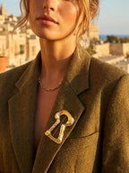   1 gold lock brooch