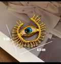 Blue eye strass gold brooch