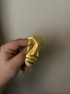 gold half face brooch
