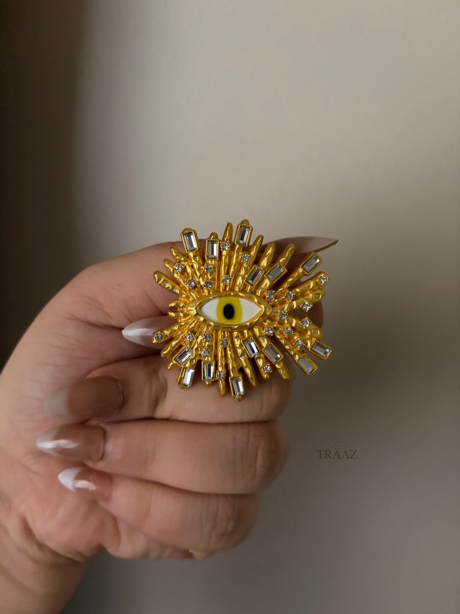 strass gold eye brooch