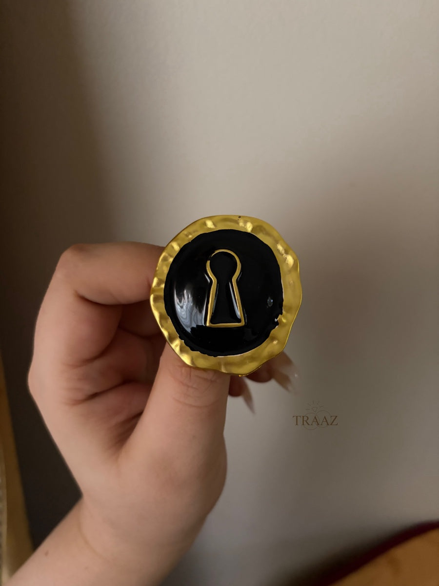 black & gold lock brooch