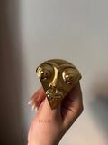 Face  brooch