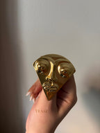 Face  brooch